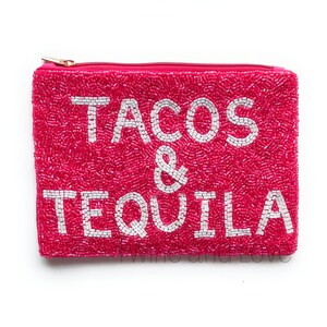 May include: A pink beaded zippered pouch with the text "TACOS & TEQUILA" in white beads.