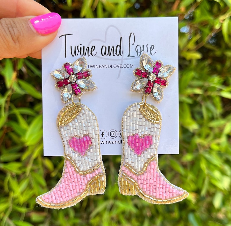 Handmade light pink cowgirl boots with a hear on the middle