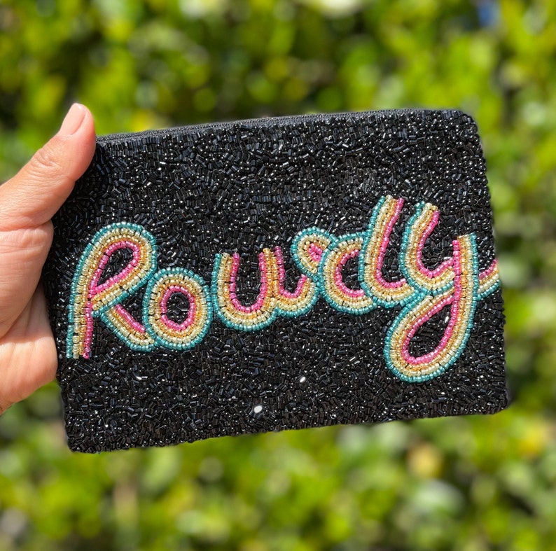 May include: Black beaded clutch with the word "Rowdy" spelled out in colorful beads.