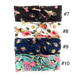 May include: Four floral patterned headbands in different colours and patterns. The headbands are arranged vertically, with the top headband being black with white and pink flowers, the second headband being white with pink and green flowers, the third headband being navy blue with white and pink flowers, and the bottom headband being teal with pink and white flowers. The headbands are numbered 7 through 10.
