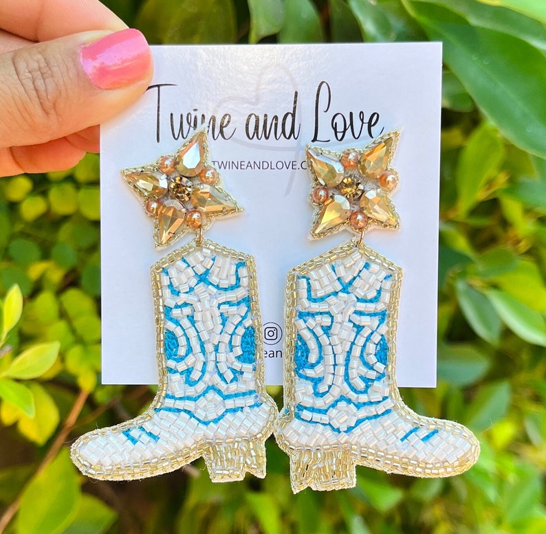 Handmade blue and white cowgirls boots with a gold border.