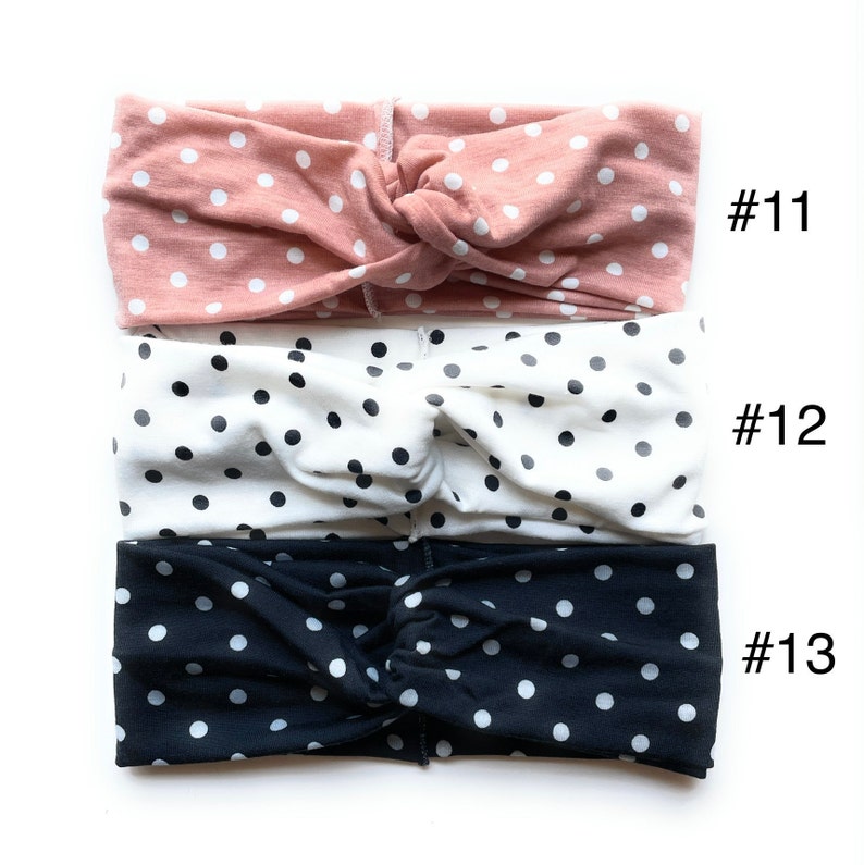 May include: Three knotted headbands with polka dot patterns. The top headband is pink with white dots, the middle headband is white with black dots, and the bottom headband is black with white dots. #11, #12, #13