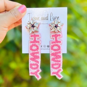 Handmade earrings with the wordy HOWDY in pink
