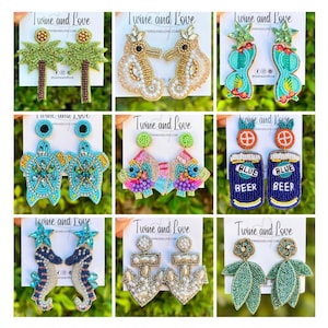 May include: Nine pairs of beaded earrings with various summer-themed designs, including palm trees, seahorses, turtles, fish, beer cans, anchors, and leaves. The earrings are all handmade and feature colorful beads and intricate details.