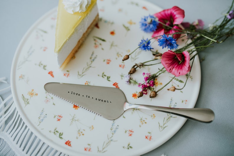 Cake shovel server in silver color with hand stamped text love is sweet