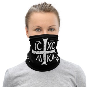 May include: Black face mask with a white Greek Orthodox cross and the text "IC XC NIKA" in a distressed font.