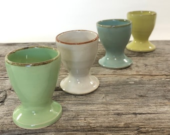 Handmade ceramic egg cups, in 10 different colors, can be pre-ordered if you wish