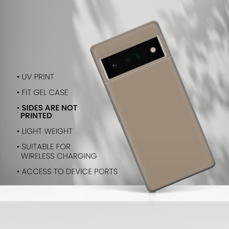 May include: A beige phone case with a black camera lens and a thin gold trim around the edges. The case is designed to fit a gel case and is suitable for wireless charging. The case has access to device ports and is printed with UV ink. The sides of the case are not printed.