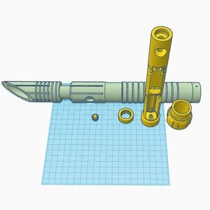 May include: A disassembled yellow lightsaber with a green blade, a small yellow piece, a yellow ring, and a yellow cap. The lightsaber is on a blue grid background.