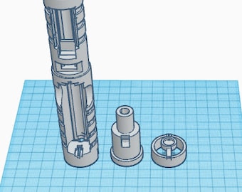 May include: A disassembled 3D printed model of a lightsaber with a gray plastic finish. The model consists of three parts: a long cylindrical handle, a smaller cylindrical piece, and a circular piece.