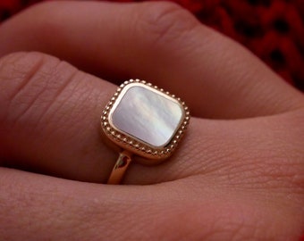 Gold plated ring with natural mother of pearl stone