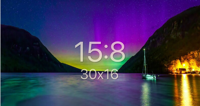 May include: A scenic landscape photograph featuring a lake with a sailboat, mountains, and a vibrant night sky. The sky displays a colorful aurora borealis effect. Text on the image reads "15:8" and "30x16".