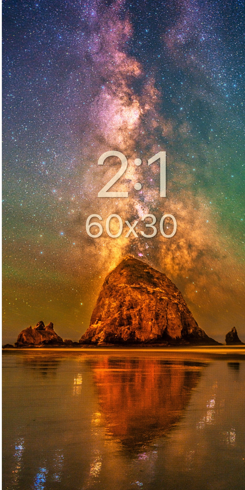 May include: A wall art print featuring a night sky filled with stars and a nebula above a large rock formation on a beach. The text 2:1 and 60x30 is printed in white in the centre. The scene displays orange, purple, and green hues.