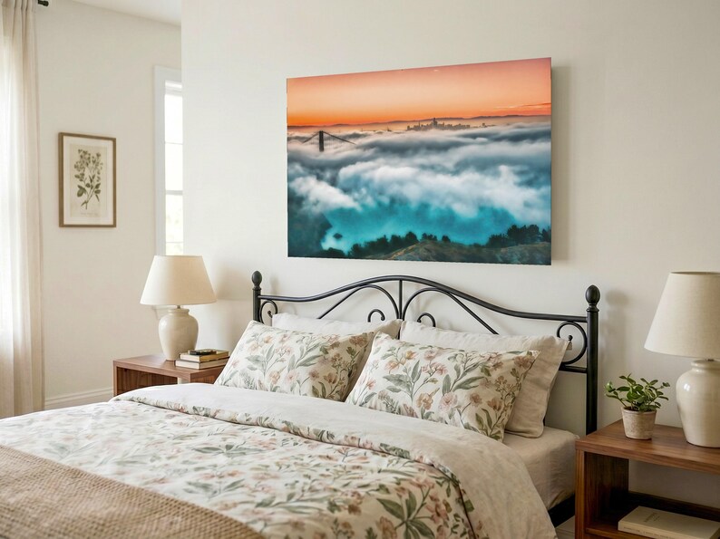 May include: A rectangular wall art print featuring a landscape photograph of the Golden Gate Bridge partially obscured by a thick layer of fog, with a vibrant orange sunset sky above and dark green hills visible in the foreground below the clouds.