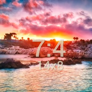 May include: A scenic sunset over a beach with rocky outcrops and palm trees. The sky is a vibrant mix of pink, orange, and blue. The text "7:4 14x8" is superimposed on the image.