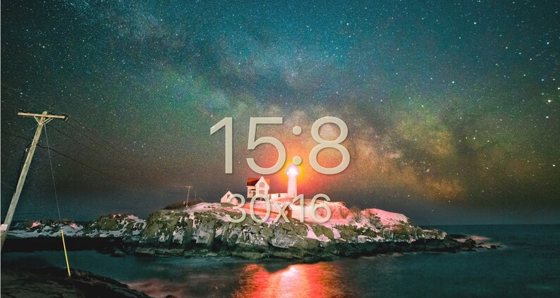 May include: A lighthouse on a rocky island with the Milky Way visible in the night sky. The lighthouse is lit up and the water is reflecting the light. The text "15:8 30x16" is superimposed on the image.