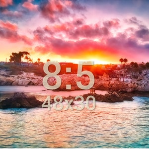 May include: A scenic sunset over a rocky beach with a bright orange sky and clouds. The text "8:5 48x30" is superimposed on the image.