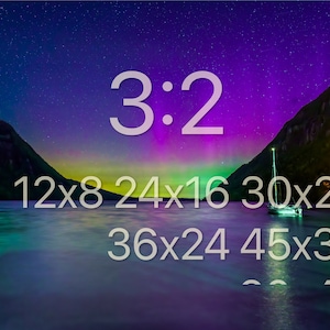 May include: A scenic landscape featuring a lake with a sailboat, mountains, and a vibrant night sky with the text "3:2" and various size options in inches: 12x8, 24x16, 30x20, 36x24, and 45x30.