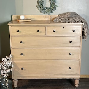 Antique refinished natural wood rustic “raw wood look” five drawer large dresser with metal casters and working key