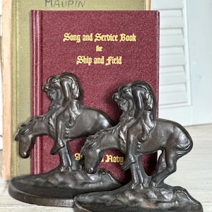 The Last Trail bookends; cast iron bookends; vintage bookends