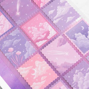 May include: A sheet of decorative stickers featuring square designs with a dreamy, pastel sky theme. Each sticker showcases a different scene with clouds, stars, and a crescent moon in shades of pink and purple.