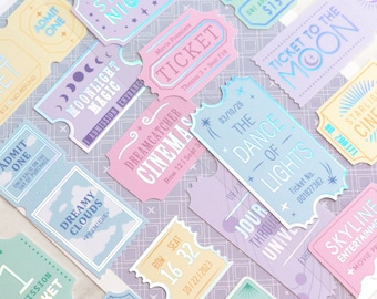 May include: A collection of colorful, holographic stickers featuring movie ticket designs. The stickers have various titles, including "Starry Night", "Moonlight Magic", "Dreamcatcher Cinemas", "The Dance of Lights", "Ticket to the Moon", and "Skyline Entertainment".