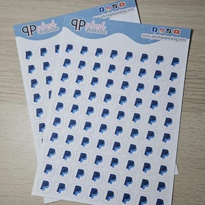 May include: Two sheets of white sticker paper with a blue and white PayPal logo repeated on each sheet. The sheets are labeled "Plush Planning" with a website address and social media icons.