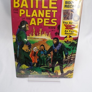 May include: A book and record set for "Battle for the Planet of the Apes". The cover features a colorful illustration of apes in a futuristic setting. The record is 45 RPM and the text on the cover reads "The Action Comes Alive As You Read!!"