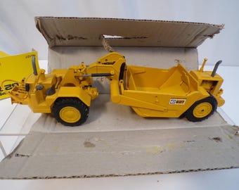 NZG Modelle No. 127 Push Pull Schurfzug (Scraper) CAT 627 Caterpillar (W. Germany - 1969)