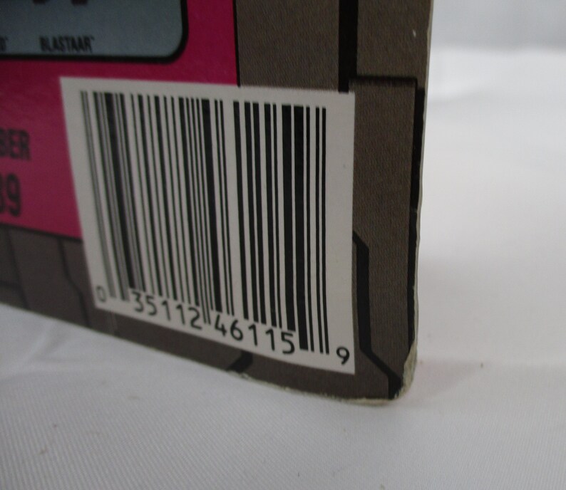 May include: Close-up of a black and white barcode with the number 0 35112 46115 9 printed below it.