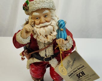 Possible Dreams Clothique - Santa Claus with Critter in Pajamas Figure (1996)