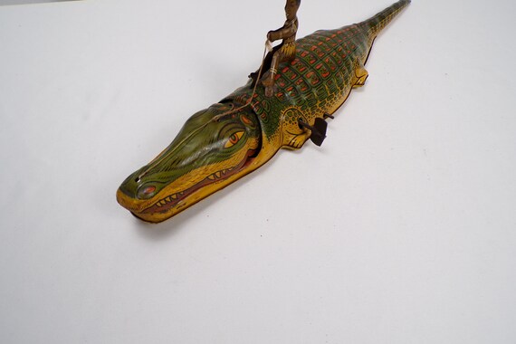 J. Chein & Co Tin Litho Indigenous Boy Riding an Alligator Wind Up