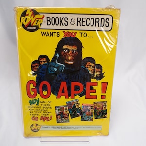 May include: A yellow and black advertisement for Power Records featuring a large ape with the text "GO APE!" and images of Planet of the Apes books and records. The text "WANTS YOU TO..." is above the ape.