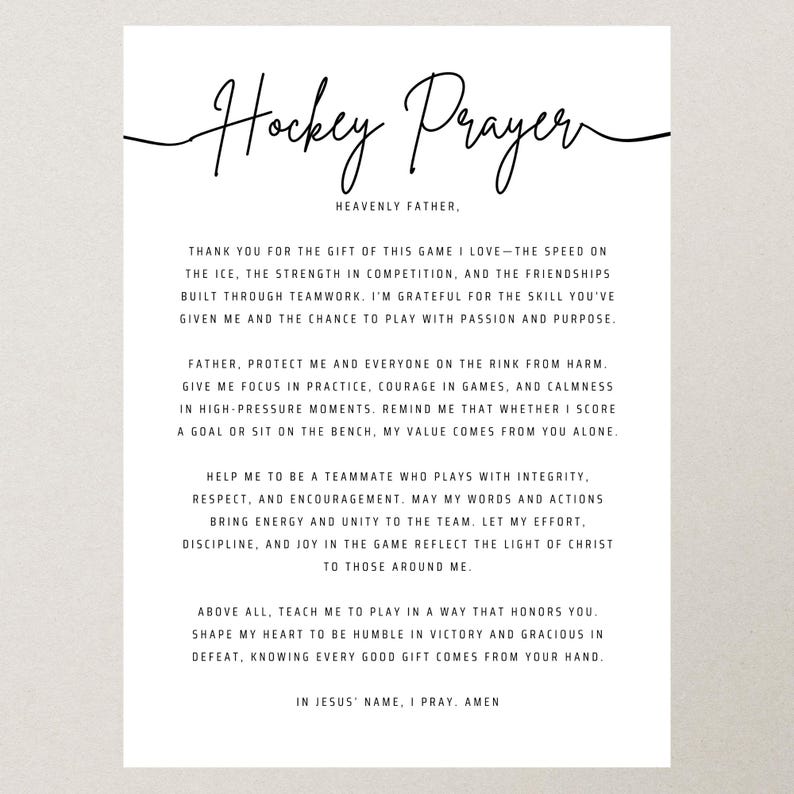 May include: A white print with the words "Hockey Prayer" in elegant script. The text includes a prayer for the game of hockey, expressing gratitude, seeking protection, and requesting guidance. The print is on a neutral background.