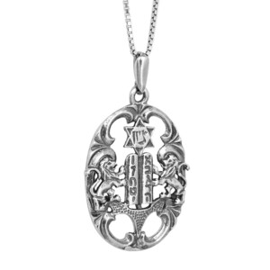 May include: A silver-coloured pendant necklace featuring an oval frame with two lions flanking a central tablet inscribed with Hebrew text. Above the tablet is a Star of David. The pendant hangs from a delicate silver-coloured box chain link necklace.