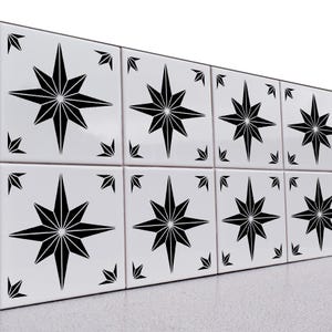 May include: A set of eight square white ceramic tiles arranged in two rows. Each tile features a prominent black eight-pointed star design centered on the surface, with smaller black star-like accents positioned in each of the four corners.