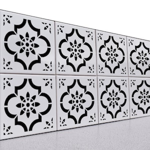 May include: Black and white patterned tile with a geometric design. The tile is made of ceramic and has a glossy finish.