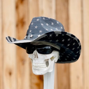Patriotic Cowboy Black Flag Hat, one size fits all, overall size 15x14, inside circumference about 23.25” in. Brim size 3.5” inches