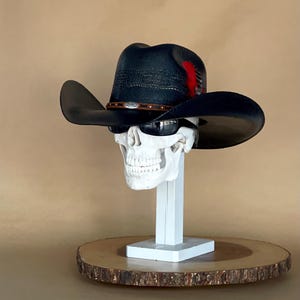 Bangora Black Cowboy hat, proudly handmade in Mexico, with an elastic sweat bandana for a comfortable fit, with rain cover and real feather.