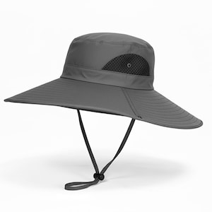 May include: A white ceramic mug with a black handle and the text "But First, Coffee" in a black, handwritten-style font. The mug is on a white surface.