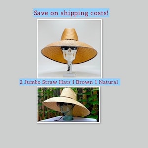 May include: Two jumbo straw hats, one brown and one natural, featuring wide brims and chin straps. The hats are displayed on mannequin heads wearing sunglasses. The text 2 Jumbo Straw Hats 1 Brown 1 Natural is visible between the two images.