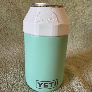 Red Bull 8.4oz Lid & can with Newer Quick Turn YETI colster can cooler (type 2) made for 12oz standard cans. Prancing Bull version shown in white.