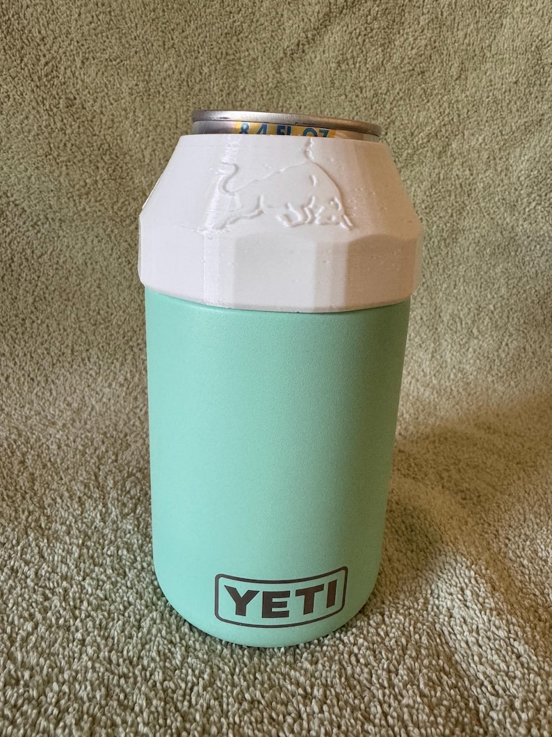 Red Bull 8.4oz Lid & can with Newer Quick Turn YETI colster can cooler (type 2) made for 12oz standard cans. Prancing Bull version shown in white.
