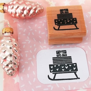 Cadeaux en traîneau à timbres