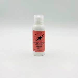May include: A white bottle of Astro Tech Jewelry-Grade Polish, labeled "Medium Step 2" with a rocket ship logo and stars.
