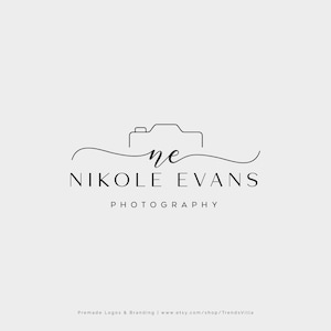 May include: Black and white logo design for a photography business. The logo features a stylized camera icon with a curved line above it. The text "Nikole Evans Photography" is below the camera icon.