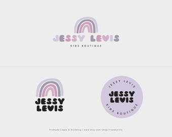 May include: Two logo designs for a children's clothing boutique called "Jessy Levis". The first logo features a rainbow with a purple, pink, and white color scheme. The second logo features a circle with a purple background and the text "Jessy Levis Kids Boutique" in black.