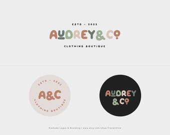 May include: The image displays a logo design for "Audrey & Co Clothing Boutique." The logo includes the text "ESTO - 2022" and the words "AUDREY & CO" in a rounded font. Two circular logo variations with the initials "A&C" are also shown.