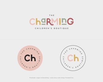 May include: Two logo designs for a children's boutique called "The Charming Children's Boutique". The first logo features the text "The Charming" in colourful, stacked letters. The second logo is a circular design with the text "The Charming Children's Boutique" surrounding the letters "Ch" in a pink circle.