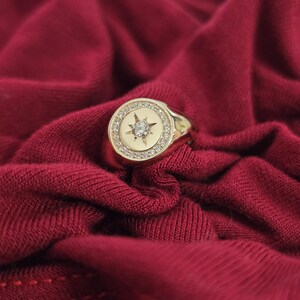 May include: A set of three ceramic mugs with a speckled, matte finish. The mugs are in shades of cream, light grey, and dark grey. Each mug has a simple, minimalist design, ideal for coffee or tea.